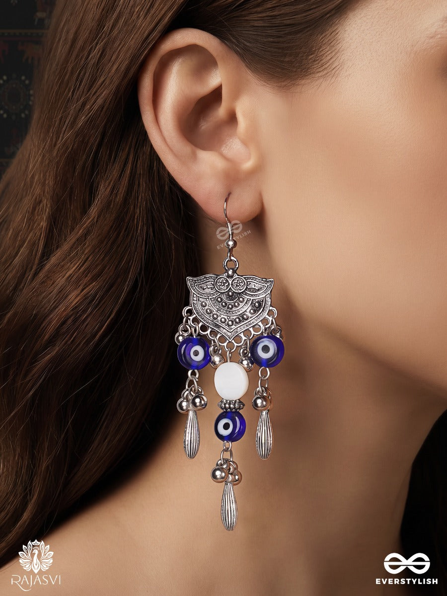 Drishtika – Oxidised Earrings With Blue Evil Eye Beads, Ghungroo Drops And White Accents