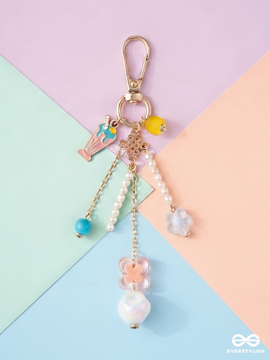 Pocket Bloom – Pastel Bag Charm With Floral And Pearl Details