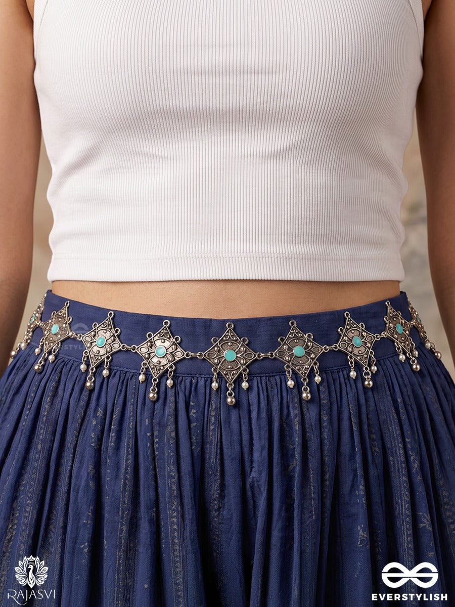 Parnavi – Oxidised Waist Chain With Floral Motifs And Green Stone Accents