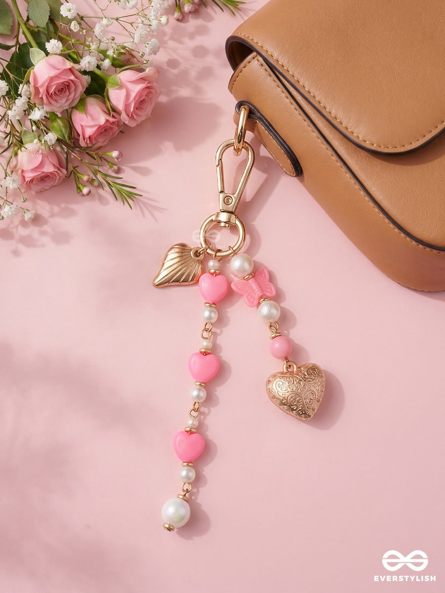 Heart Wings – Winged Heart Bag Charm With Pink And White Bead Details