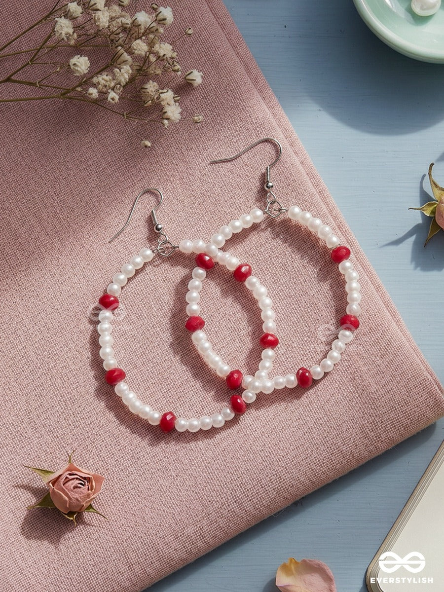 Snow & Ruby – Pearl Oval Hoop Earrings With Crimson Bead Accents