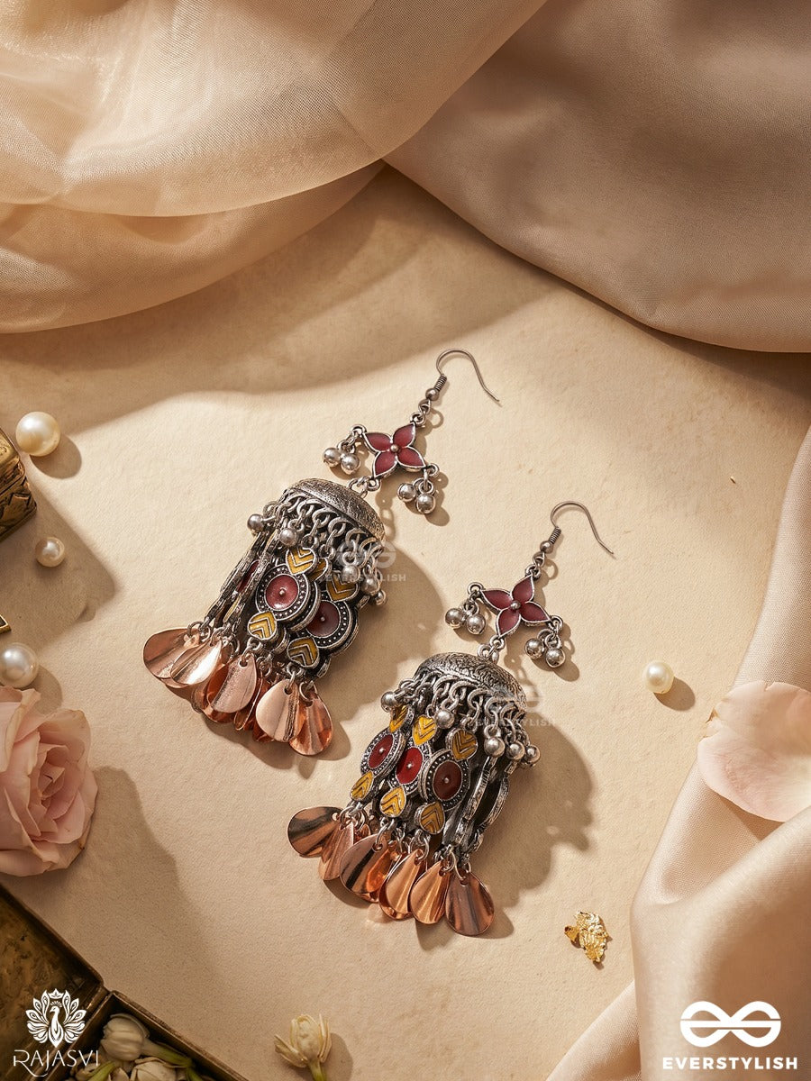 Rangmadhuri – Oxidised Jhumka Earrings With Maroon Enamel, Tribal Panels And Rose Gold Leaf Drops