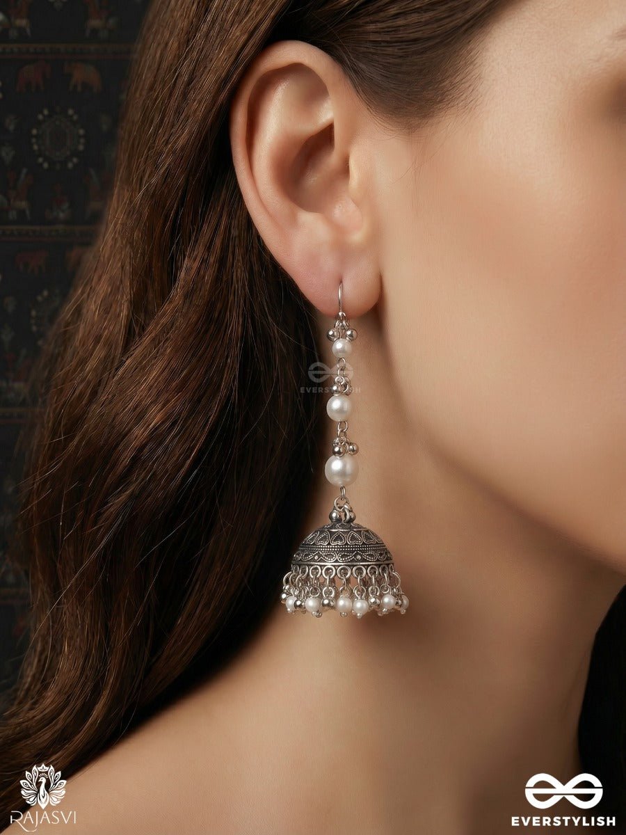 Chandrima – Oxidised Jhumkas With Lustrous Pearl Strands And Carved Dome