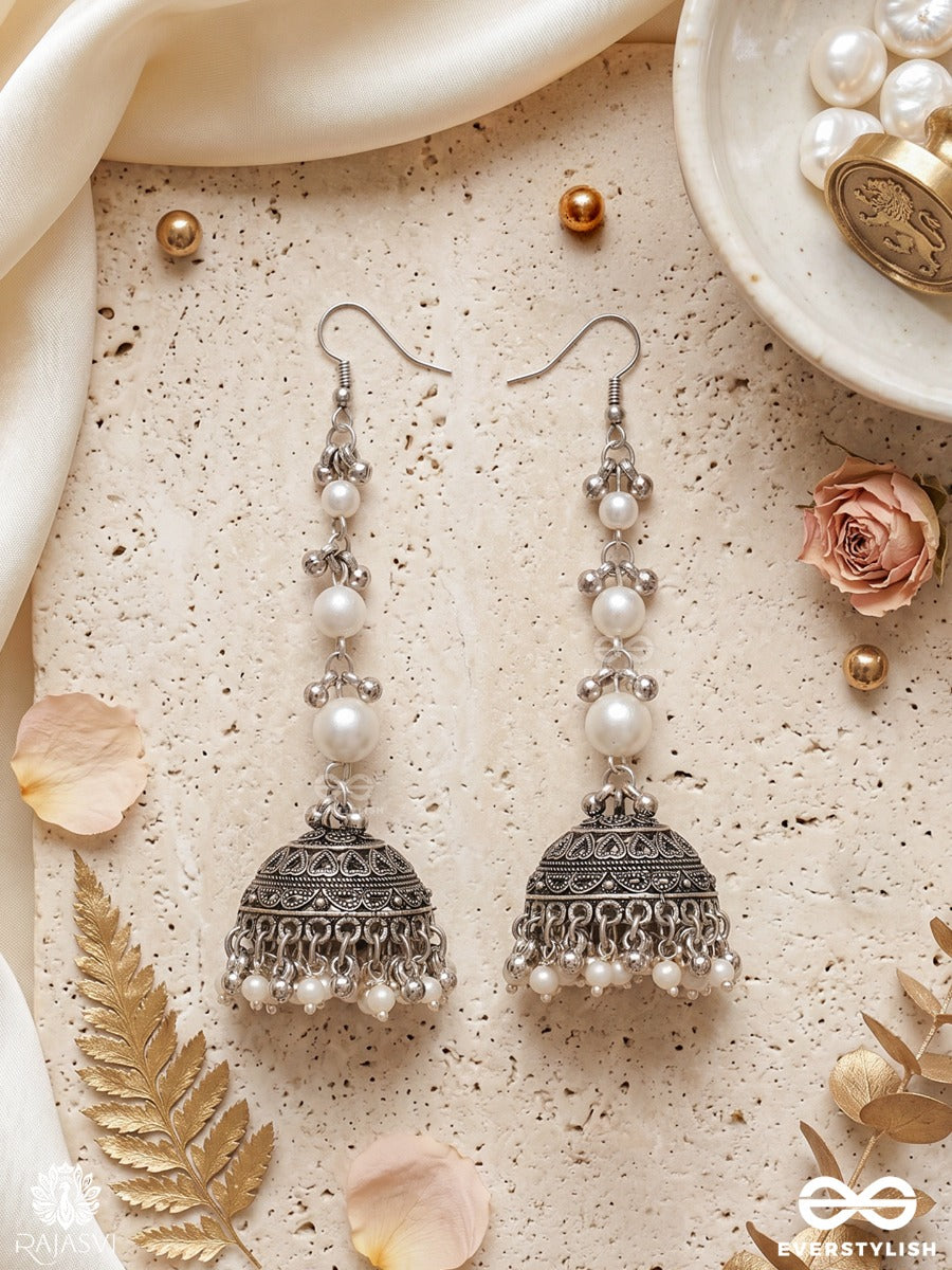 Chandrima – Oxidised Jhumkas With Lustrous Pearl Strands And Carved Dome