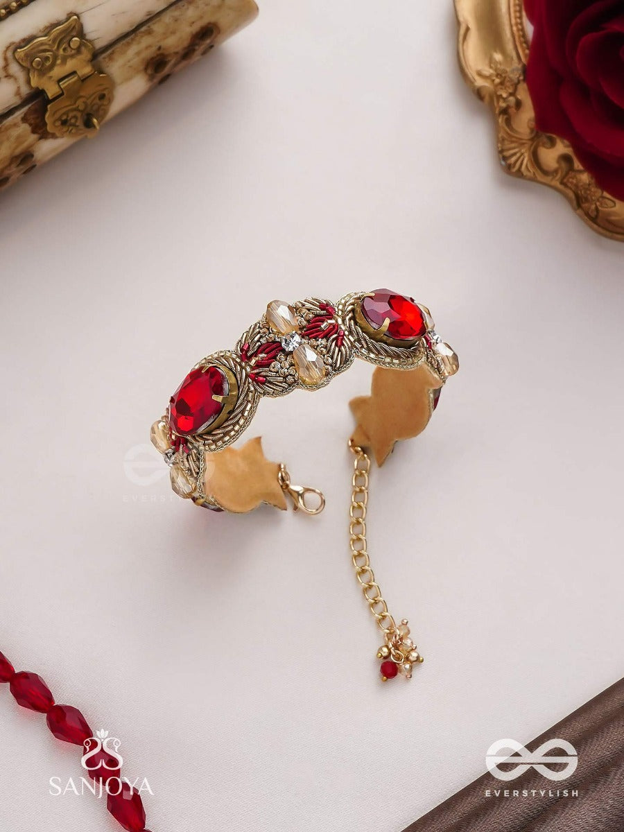 Sundarasura- Beautiful Wine- Bracelet With Rich Hue Of The Red Stones And Twisted Thread Work.