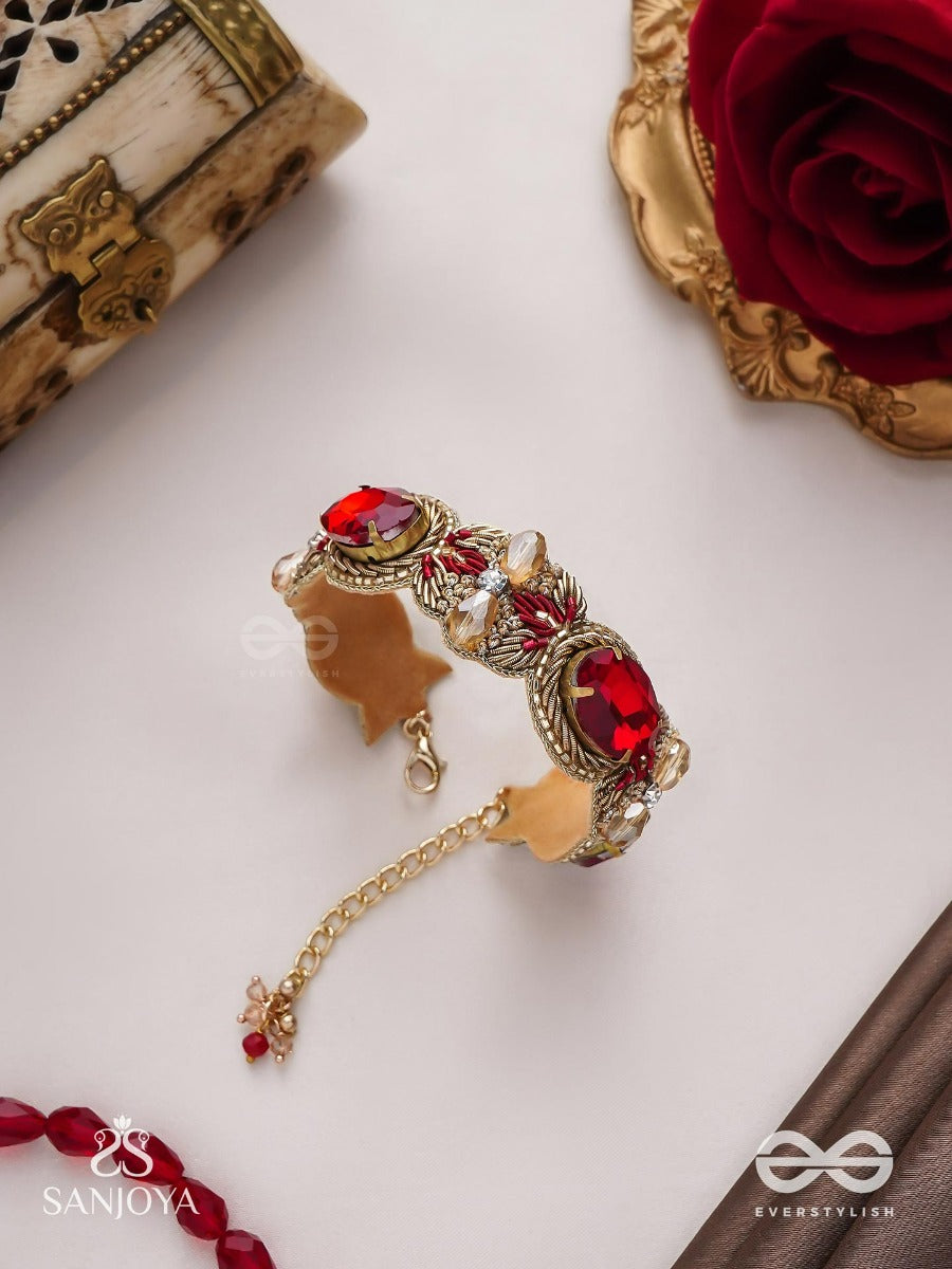Sundarasura- Beautiful Wine- Bracelet With Rich Hue Of The Red Stones And Twisted Thread Work.