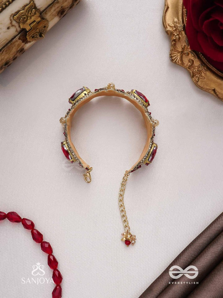 Sundarasura- Beautiful Wine- Bracelet With Rich Hue Of The Red Stones And Twisted Thread Work.