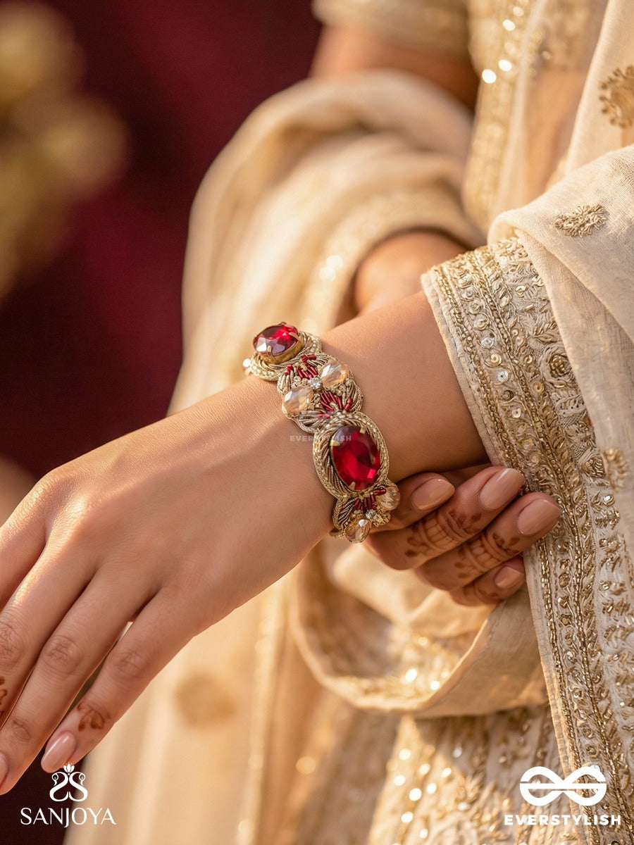 Sundarasura- Beautiful Wine- Bracelet With Rich Hue Of The Red Stones And Twisted Thread Work.