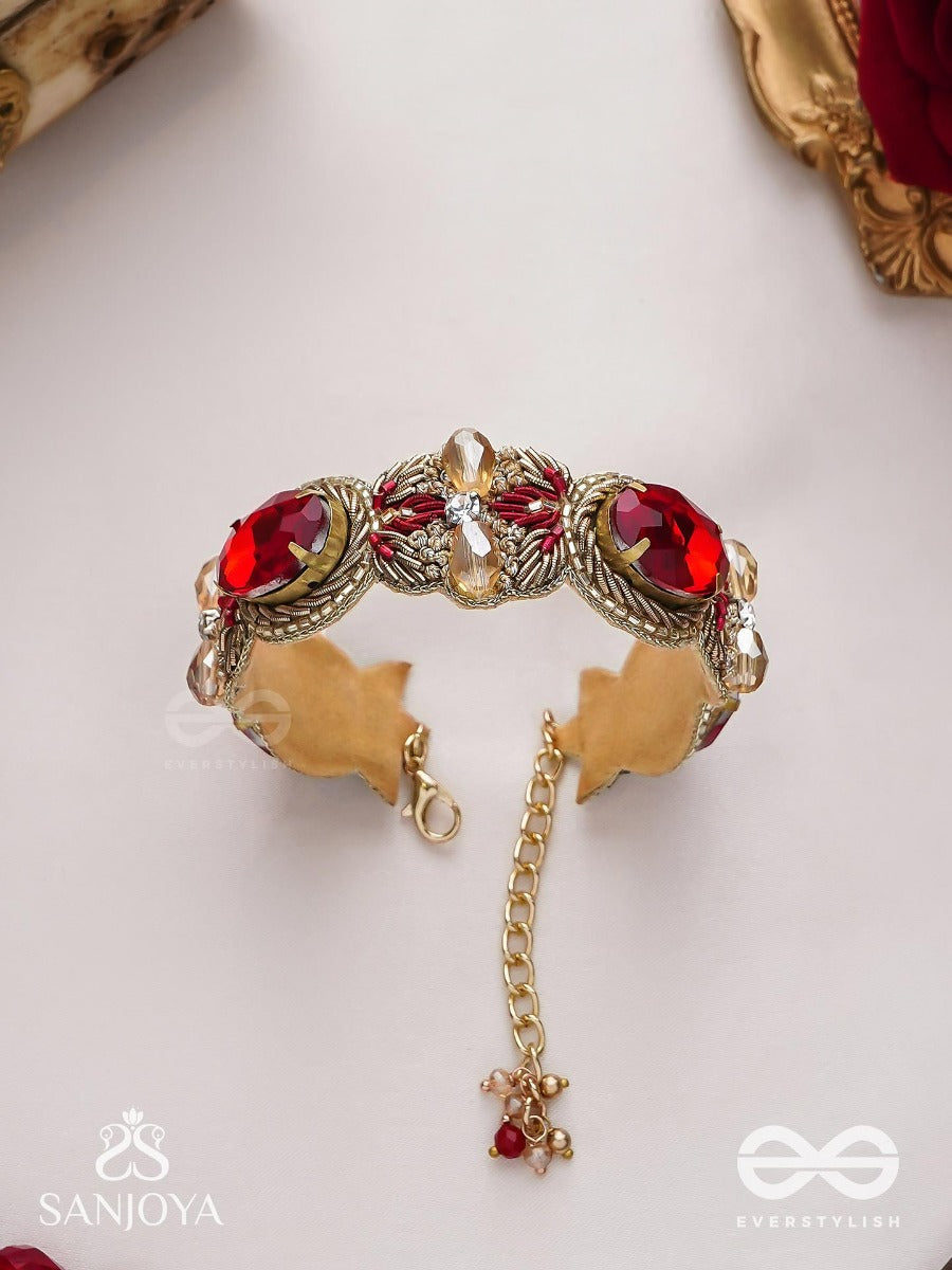 Sundarasura- Beautiful Wine- Bracelet With Rich Hue Of The Red Stones And Twisted Thread Work.