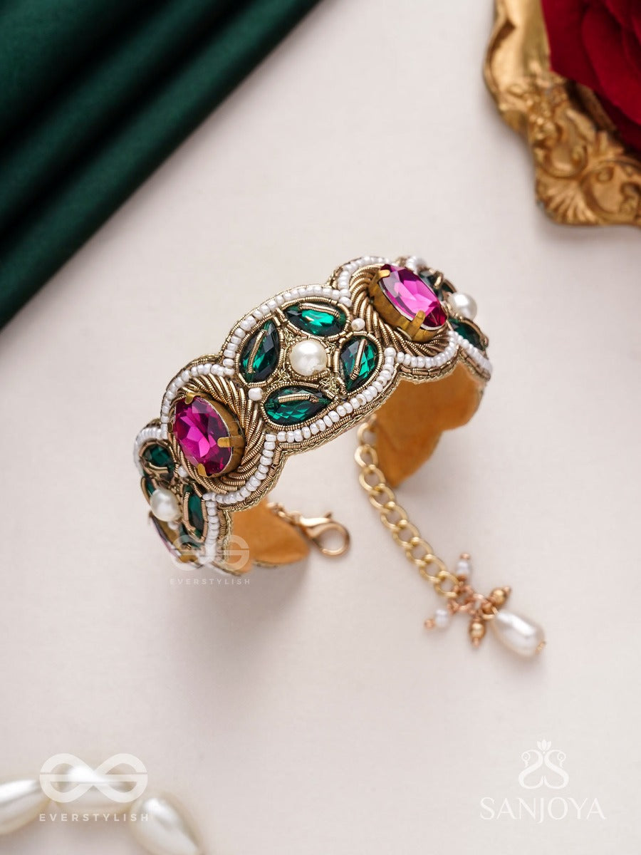 Tarangini-Wavy Beauty-Opulent Bracelet Embedded With Purple And Green Stones