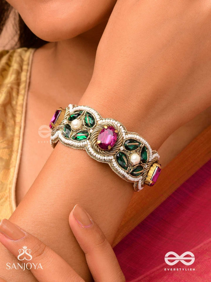 Tarangini-Wavy Beauty-Opulent Bracelet Embedded With Purple And Green Stones