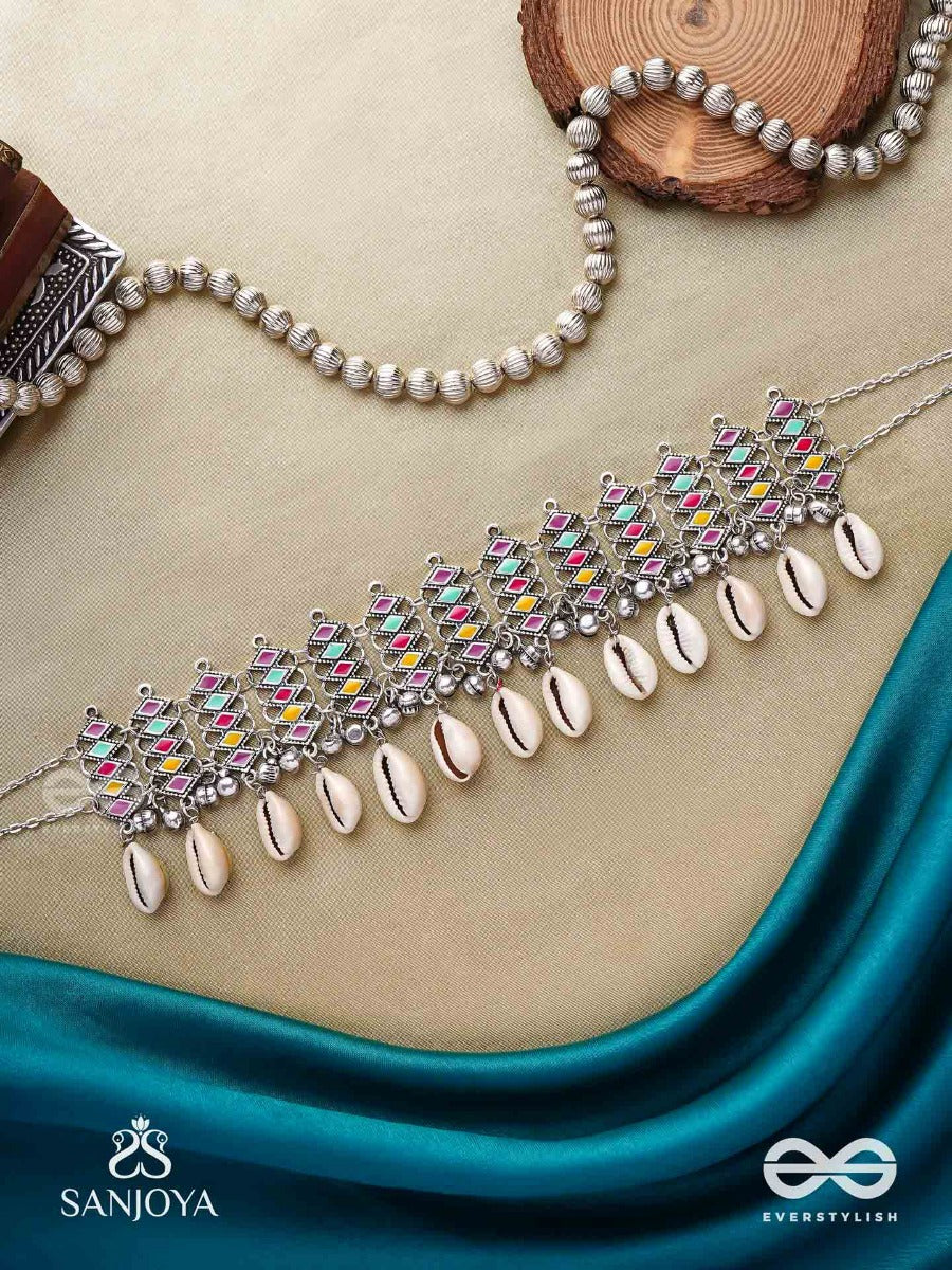 Shankhamala-Conch Garland- Oxidized Neckpiece Featuring Pastel-Coloured Metalwork, Embellished With Dangling Cowrie Shells And Ghungroo's