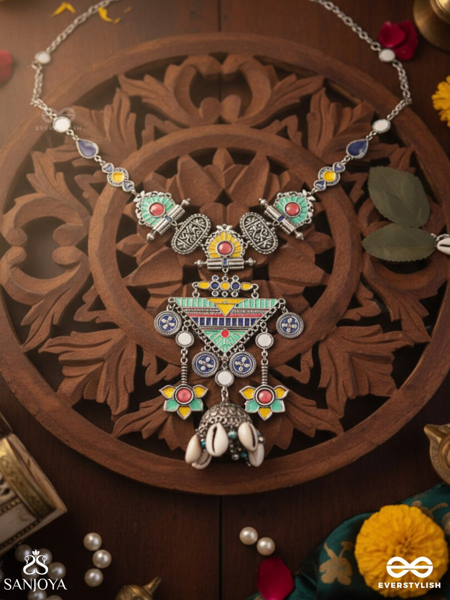 Rangapadma-Color Bloom- Enamelled Neckpiece With Cowrie Shells,Mirror And Colorful Gemstones On Oxidized Metalwork.