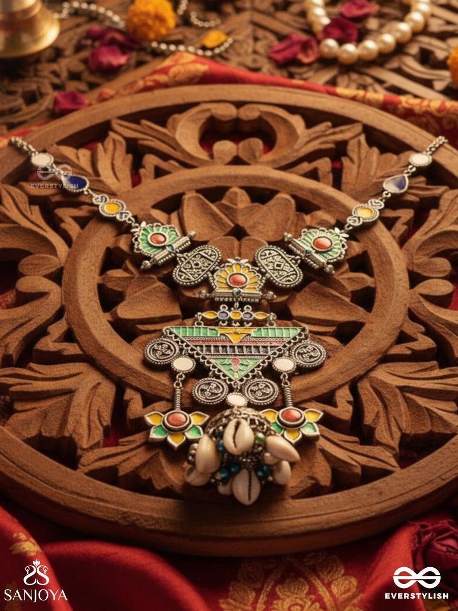 Rangapadma-Color Bloom- Enamelled Neckpiece With Cowrie Shells,Mirror And Colorful Gemstones On Oxidized Metalwork.