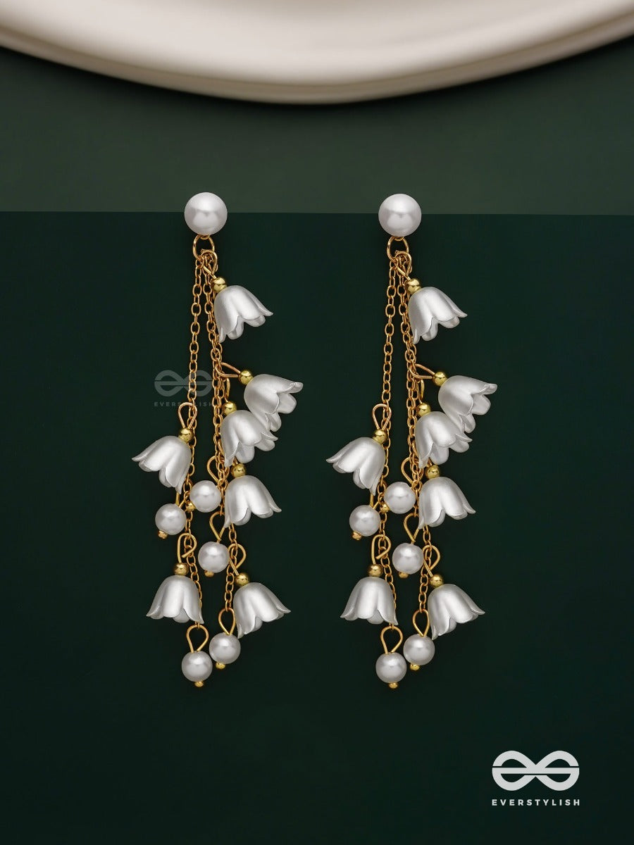 Strings Of Promise - Metallic Dangling White Rose Earrings