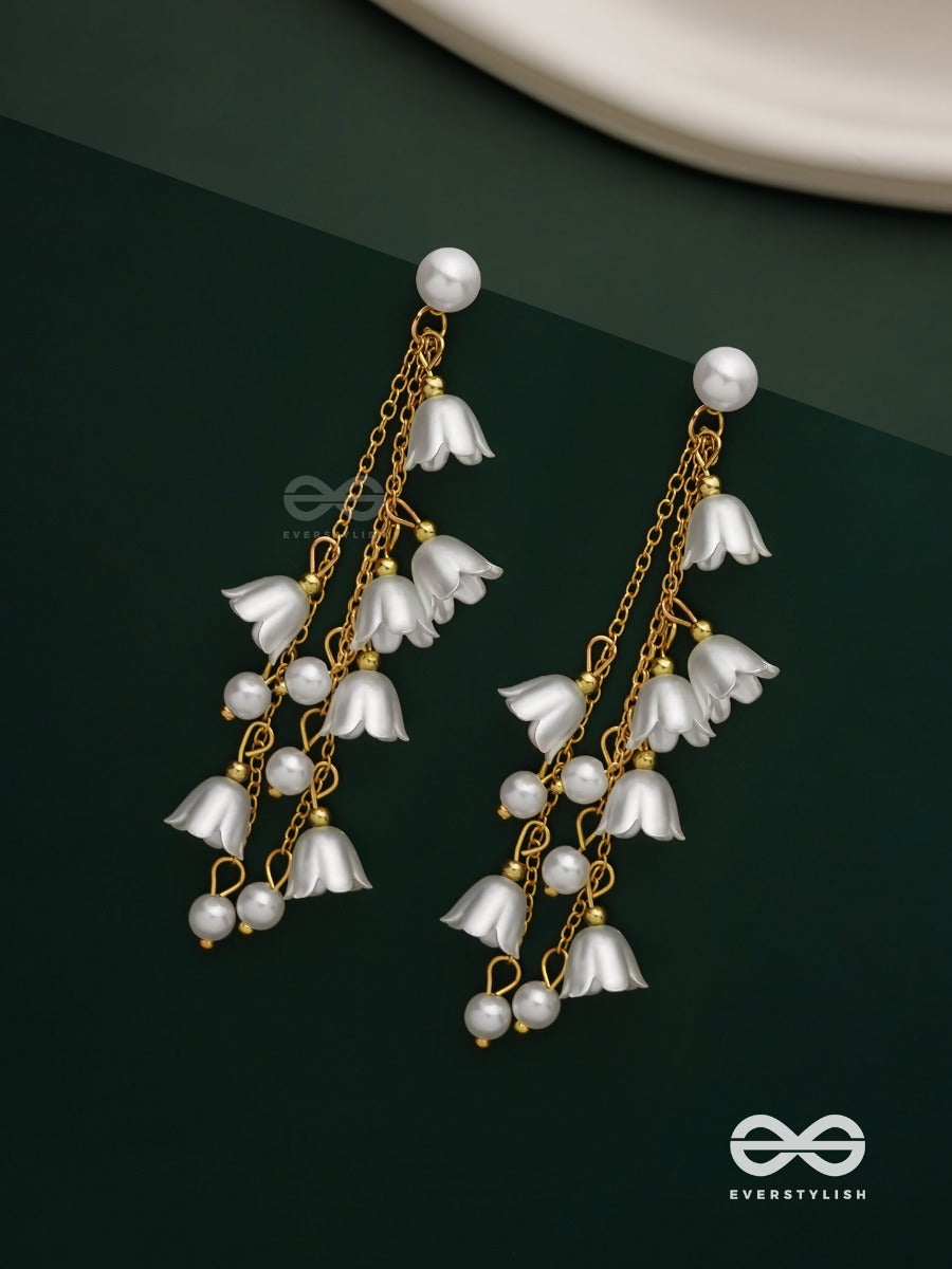 Strings Of Promise - Metallic Dangling White Rose Earrings