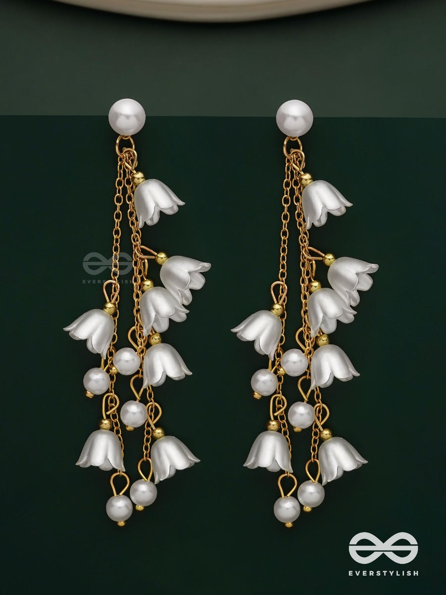 Strings Of Promise - Metallic Dangling White Rose Earrings