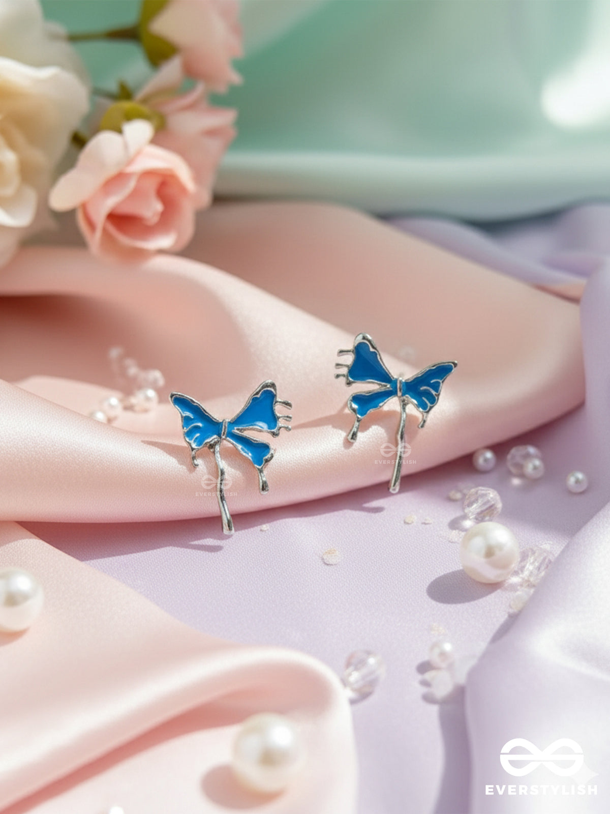 Frosty Fling - Playful Blue Bow Earrings