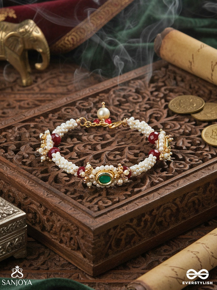 Saanvika - Softly Radiant - Delicate Pearl Bracelet Pair With Maroon Bead Accents And An Emerald-Tone Centre Detail