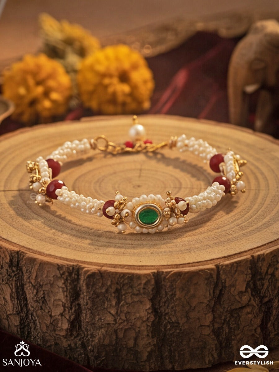 Saanvika - Softly Radiant - Delicate Pearl Bracelet Pair With Maroon Bead Accents And An Emerald-Tone Centre Detail