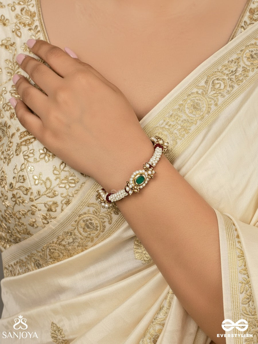 Saanvika - Softly Radiant - Delicate Pearl Bracelet Pair With Maroon Bead Accents And An Emerald-Tone Centre Detail