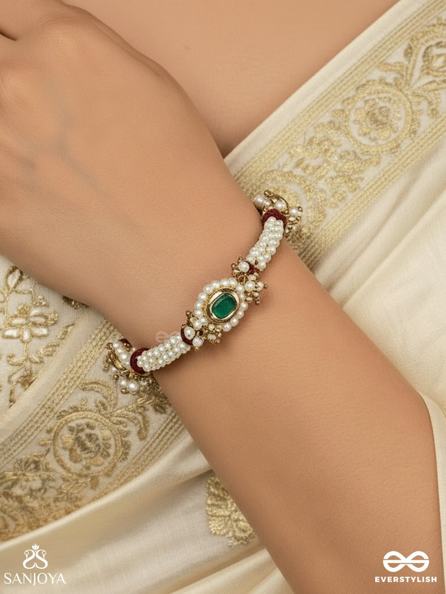 Saanvika - Softly Radiant - Delicate Pearl Bracelet Pair With Maroon Bead Accents And An Emerald-Tone Centre Detail