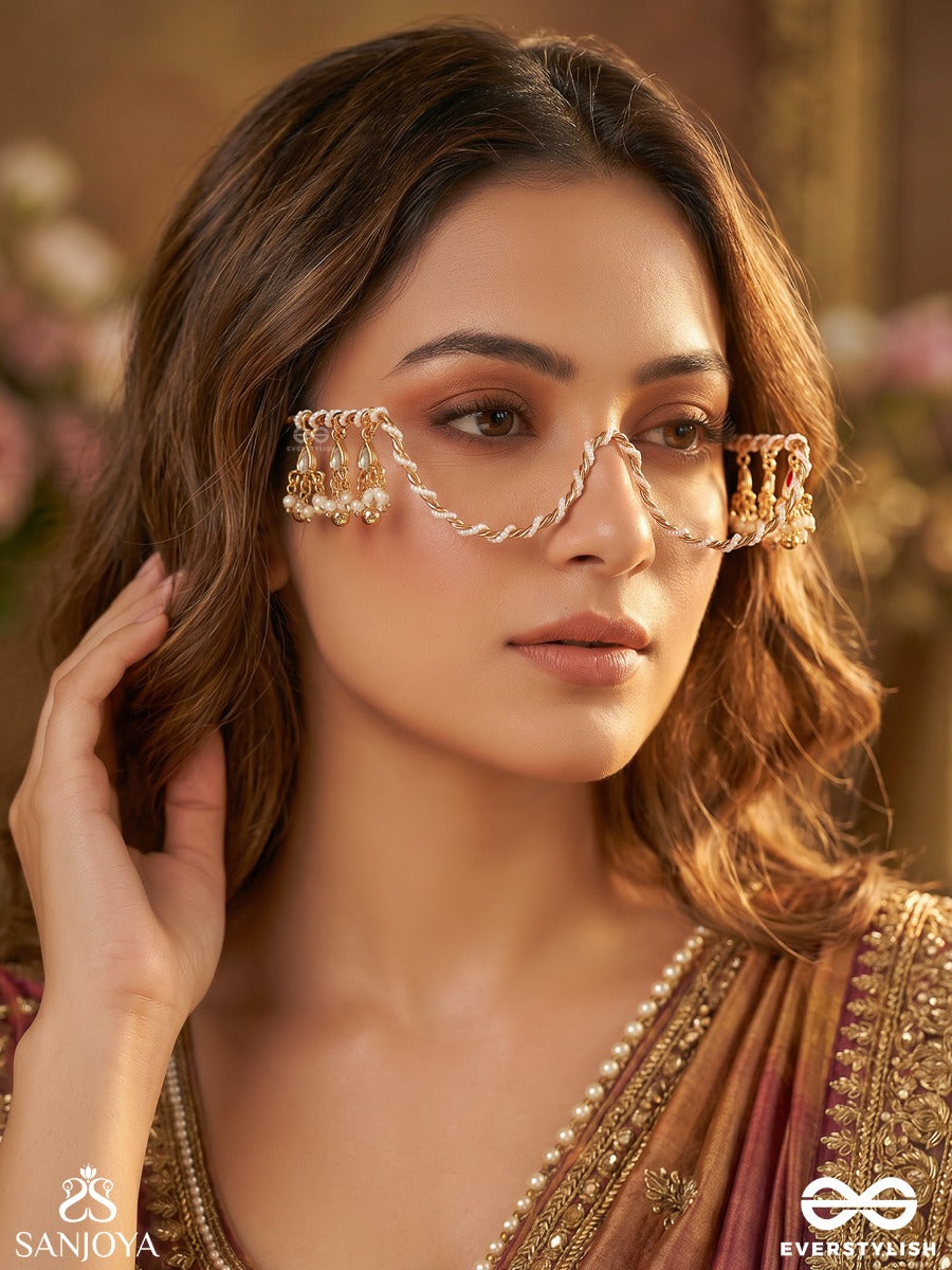 Raunaki – Festive Glow – Statement Face Let With Layered Chains And Shimmering Floral Embellishments