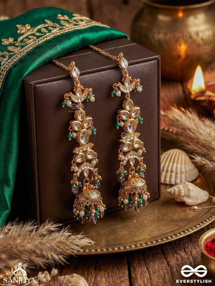 Ojasvini – Radiant Splendour – Straight Kaan Chain Earrings With Leaf-Like Stone Motifs, Deep Blue Accents, Pearl Details And Ornate Hanging Jhumka Ends