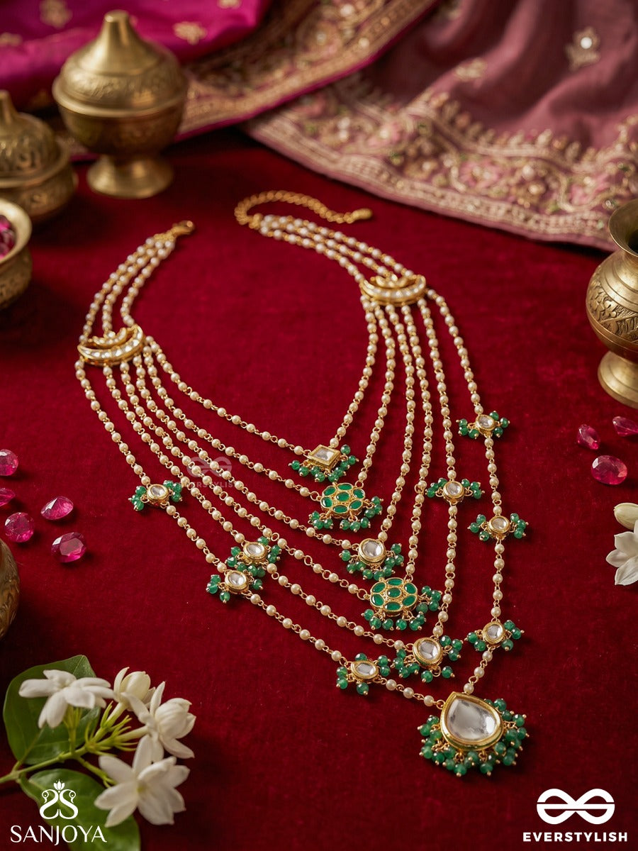 Rajveeni – Royal Melody – Ornate Rani Haar With Multi-Row Pearl Detailing, Green Embellished Motifs And Delicate Chain Falls