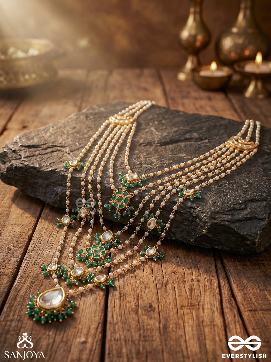 Rajveeni – Royal Melody – Ornate Rani Haar With Multi-Row Pearl Detailing, Green Embellished Motifs And Delicate Chain Falls