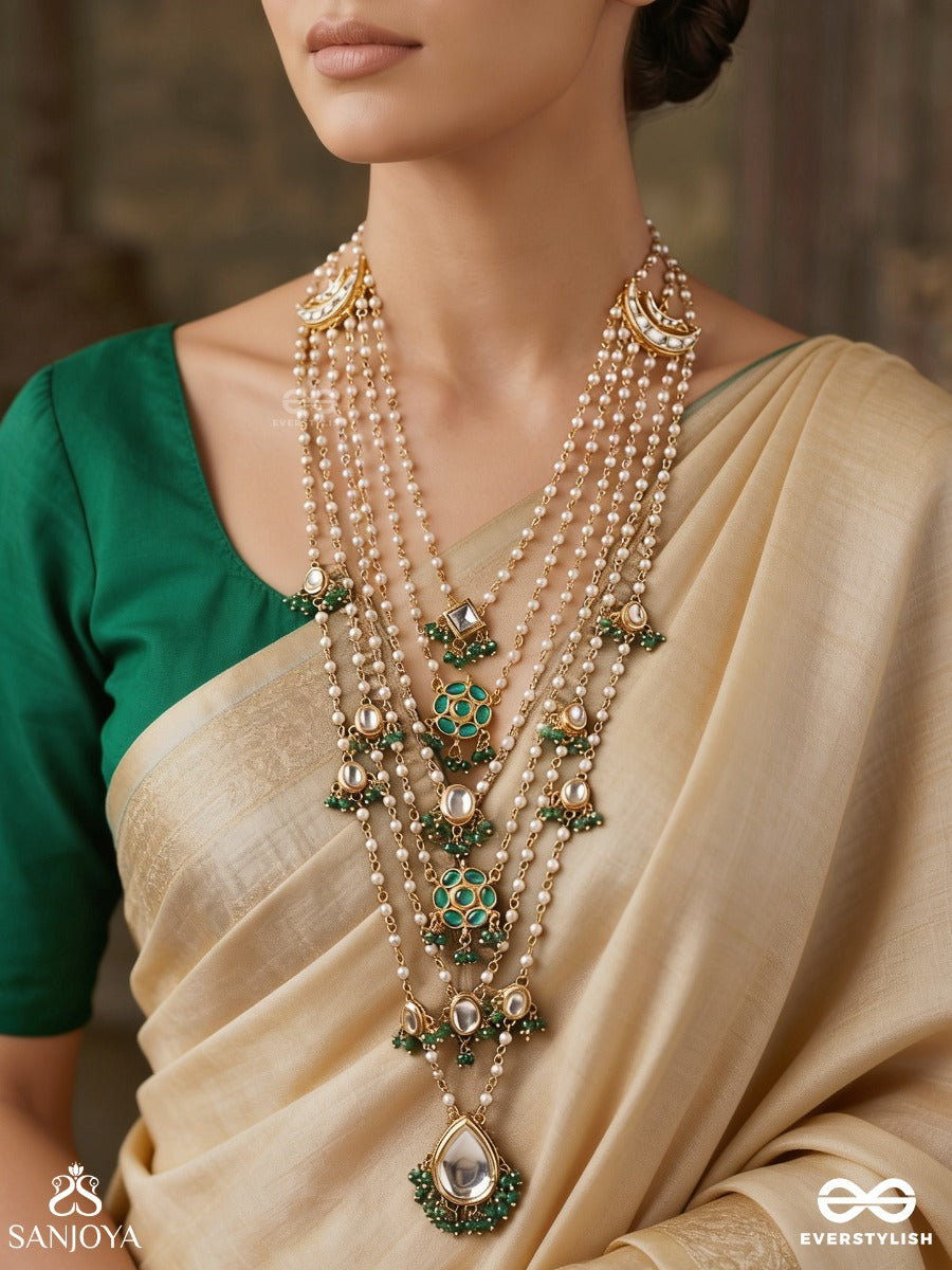 Rajveeni – Royal Melody – Ornate Rani Haar With Multi-Row Pearl Detailing, Green Embellished Motifs And Delicate Chain Falls