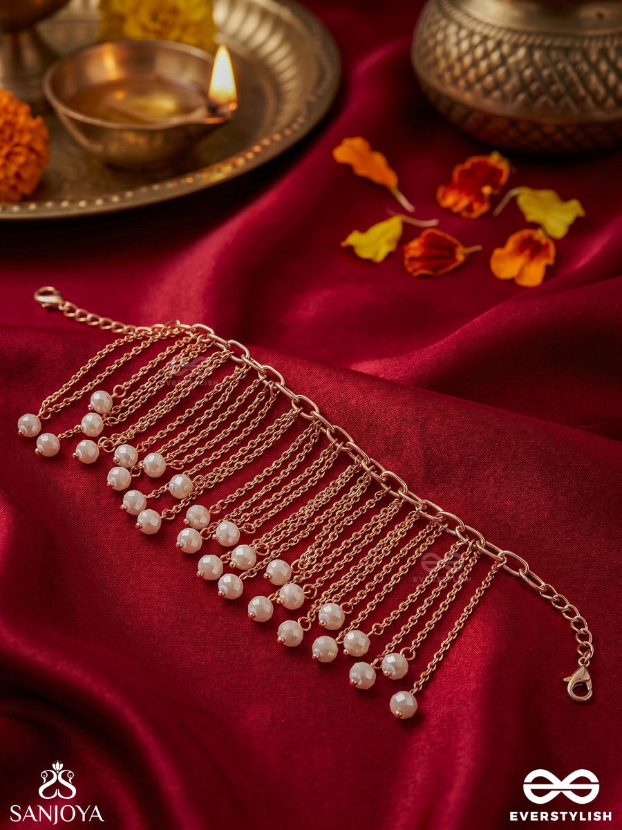 Sajlehra – Adorned Wave – Elegant Hanging Bracelet With Multi-Strand Gold-Tone Chains, Pearl-Like Drop Accents And A Flowing Tassel Finish