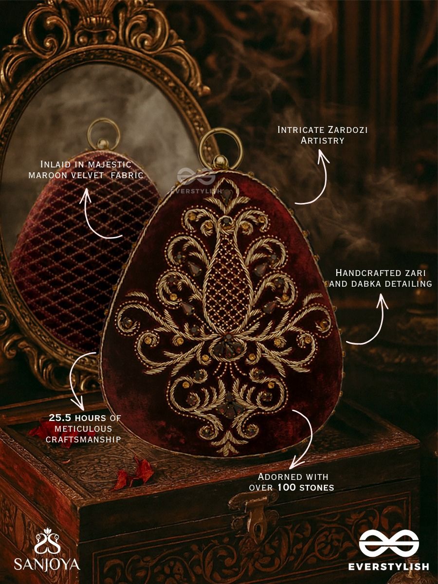 Noor – Oval Maroon Velvet Clutch With Rich Zardozi Embroidery And Golden Metal Frame