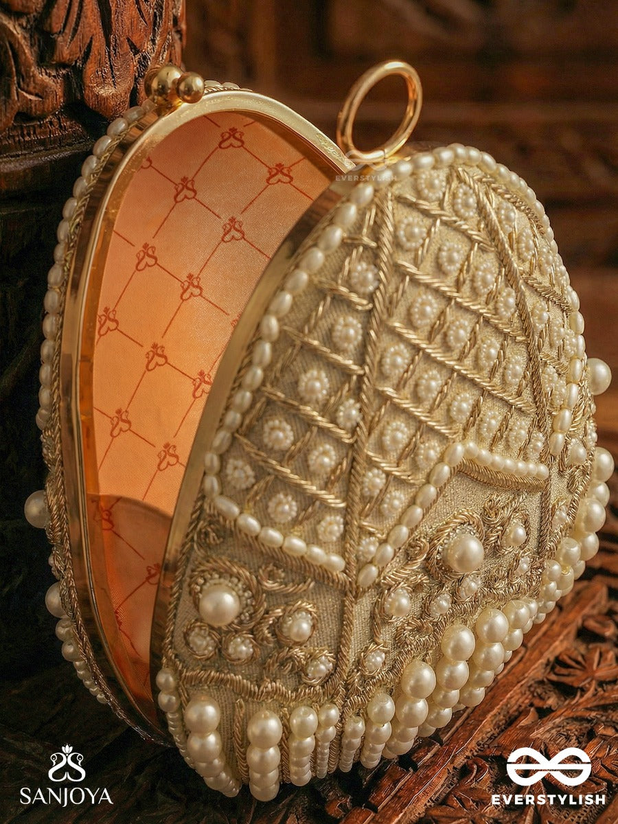 Sahiba – Oval Ivory Silk Clutch With Pearl Embedding And Golden Metal Frame