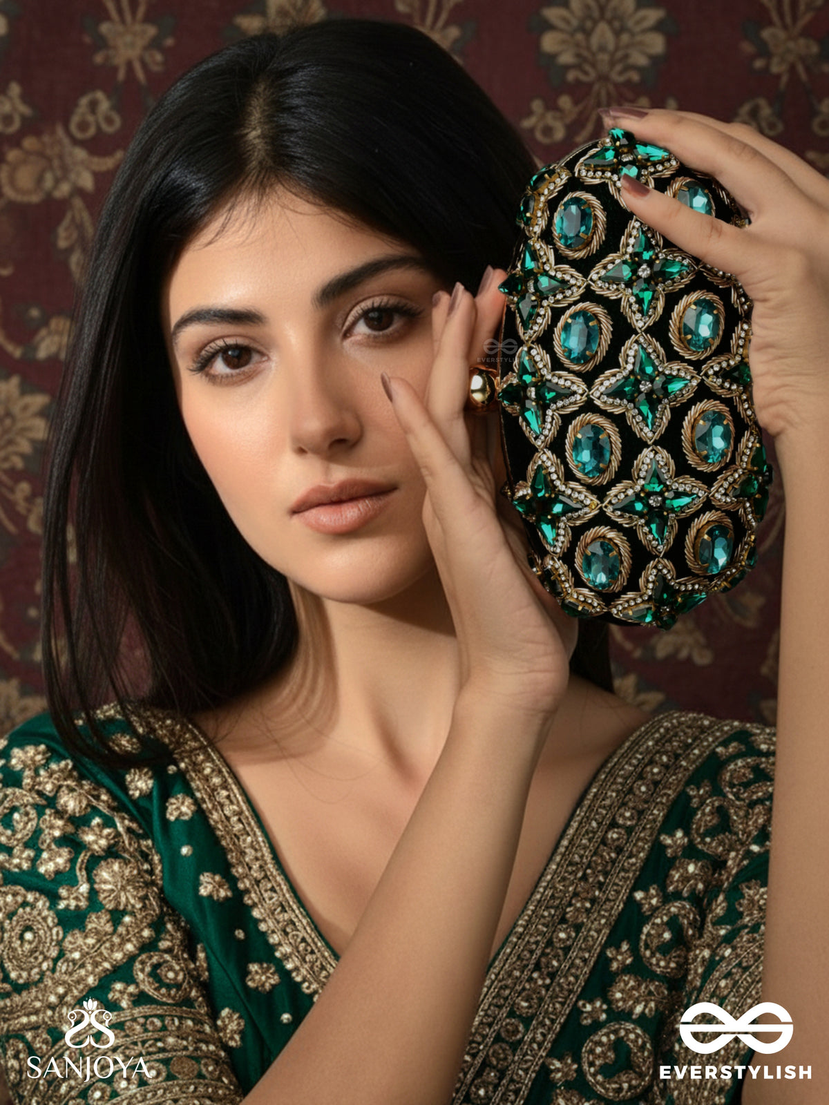 Neelzara – Oval Dark Green Velvet Clutch With Intricate Stone And Zardozi Work And Golden Metal Frame