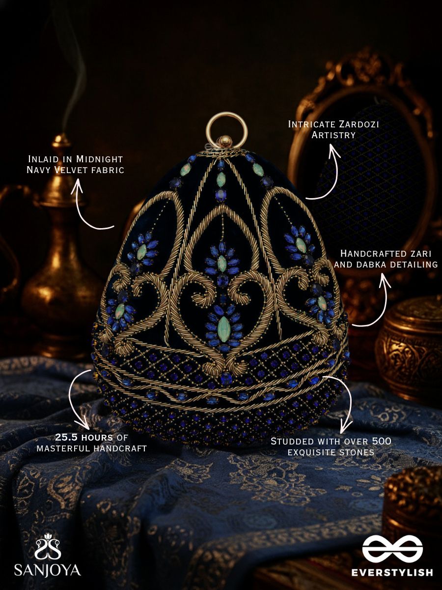 Sitaraa – Polished Oval Royal Blue Velvet Clutch With Stone-Accented Handwork And Golden Metal Frame