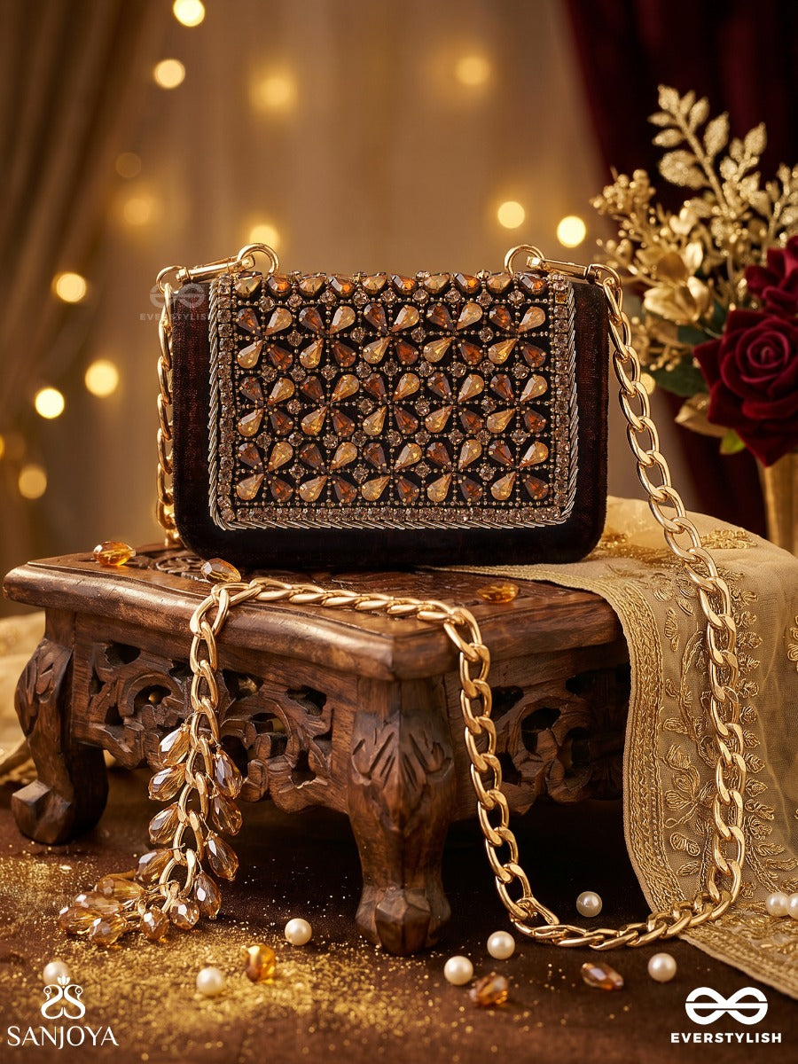 Mriganayani – Rectangular Maroon Velvet Clutch With Ornate Amber Stone Embellishment, Gold Framework And Tassel Charm