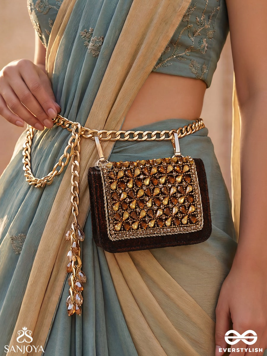 Mriganayani – Rectangular Maroon Velvet Clutch With Ornate Amber Stone Embellishment, Gold Framework And Tassel Charm