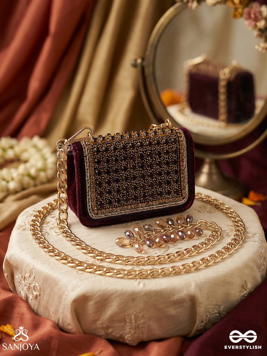 Ratnapriya – Rectangular Wine Velvet Clutch With Ruby Gem Lattice Embellishment, Gold Framework And Gem Tassel