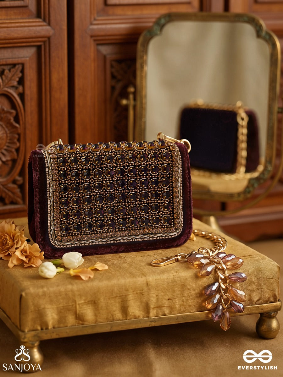 Ratnapriya – Rectangular Wine Velvet Clutch With Ruby Gem Lattice Embellishment, Gold Framework And Gem Tassel
