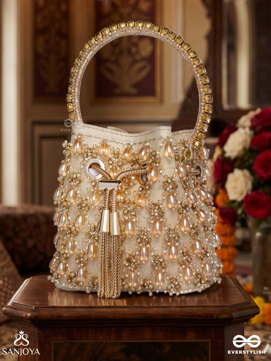 Rumana – Bucket Pale Champagne Base Bag With Cascade Pearl Detailing, Cord Lock And Embellished Handle