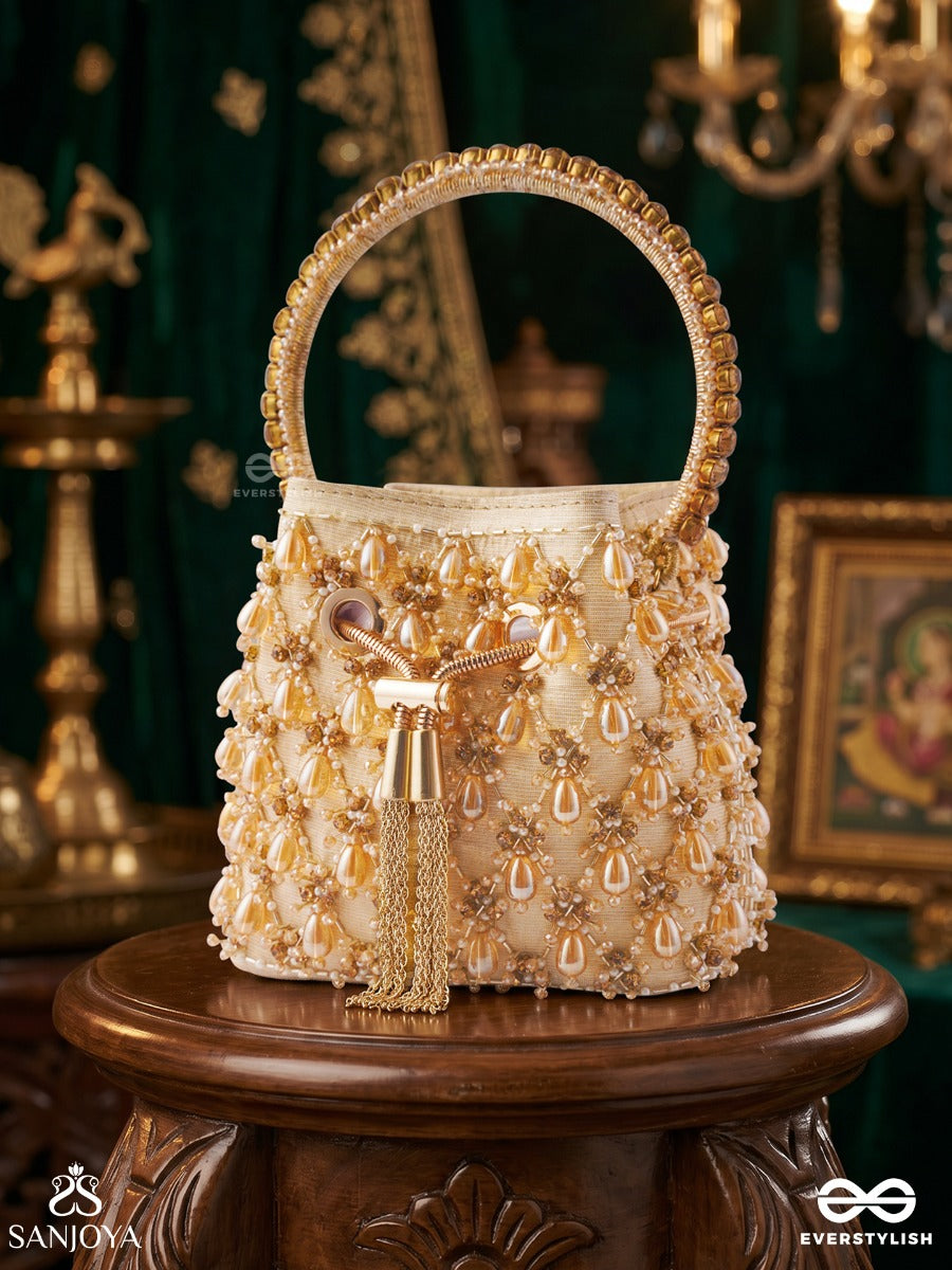 Rumana – Bucket Pale Champagne Base Bag With Cascade Pearl Detailing, Cord Lock And Embellished Handle
