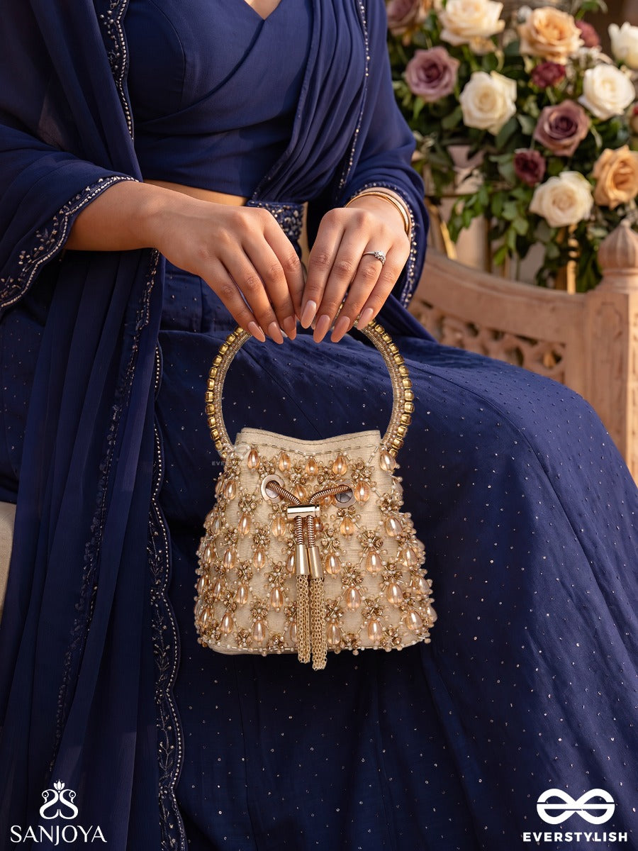 Rumana – Bucket Pale Champagne Base Bag With Cascade Pearl Detailing, Cord Lock And Embellished Handle