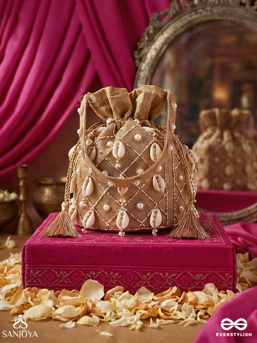 Saharish – Potli Champagne Beige Bag With Shell Embellishment, Pearl Detailing And Tassel Tie Accents