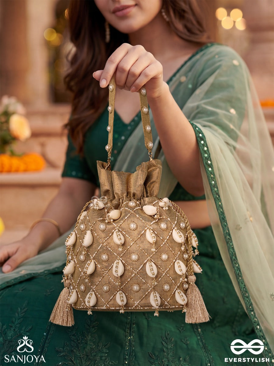 Saharish – Potli Champagne Beige Bag With Shell Embellishment, Pearl Detailing And Tassel Tie Accents