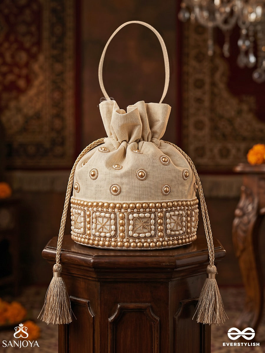 Rukhmehar – Potli Cream Champagne Bag With Pearl Panel Embellishment, Ornamental Accents And Side Tie Tassels