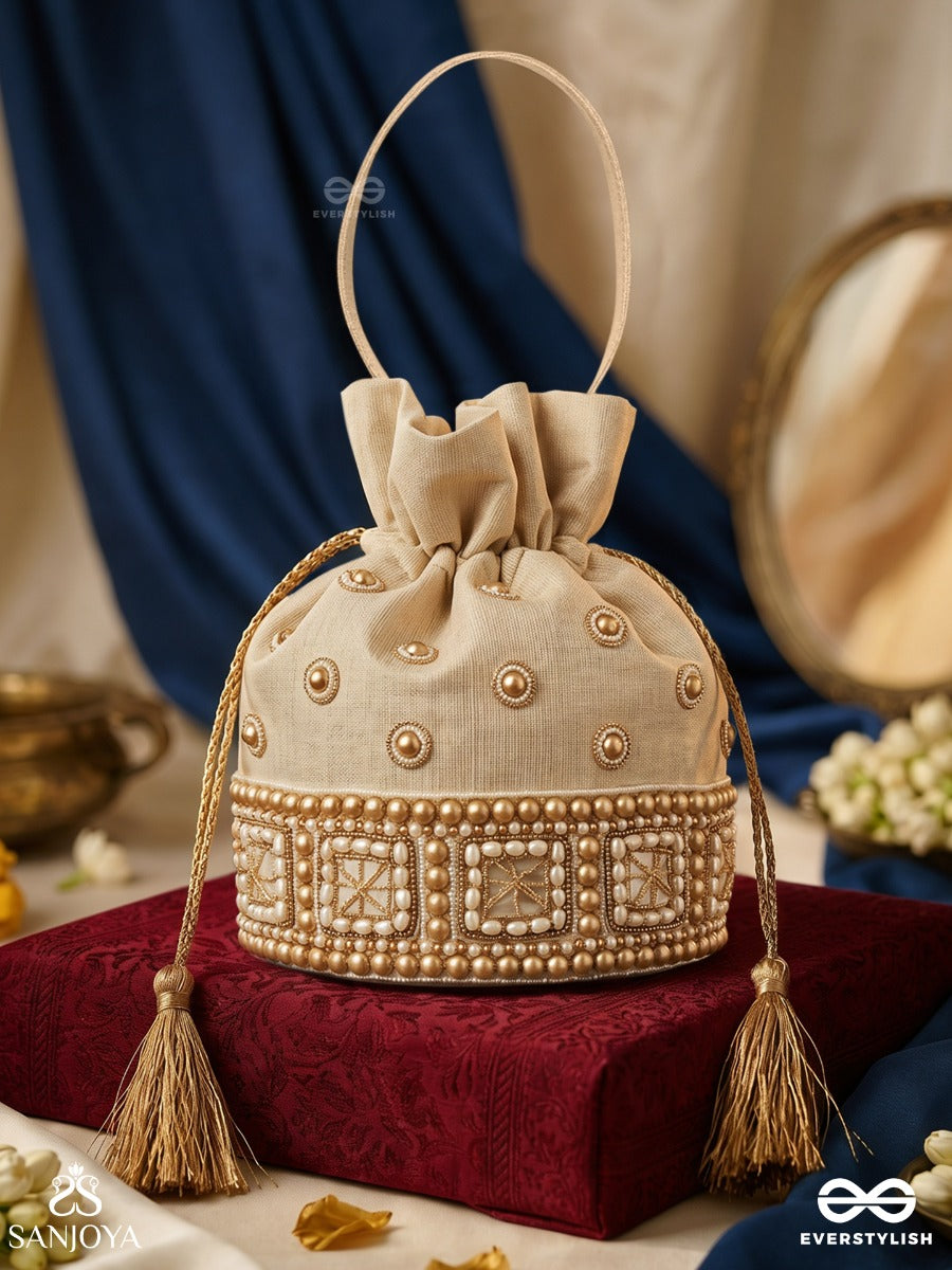 Rukhmehar – Potli Cream Champagne Bag With Pearl Panel Embellishment, Ornamental Accents And Side Tie Tassels