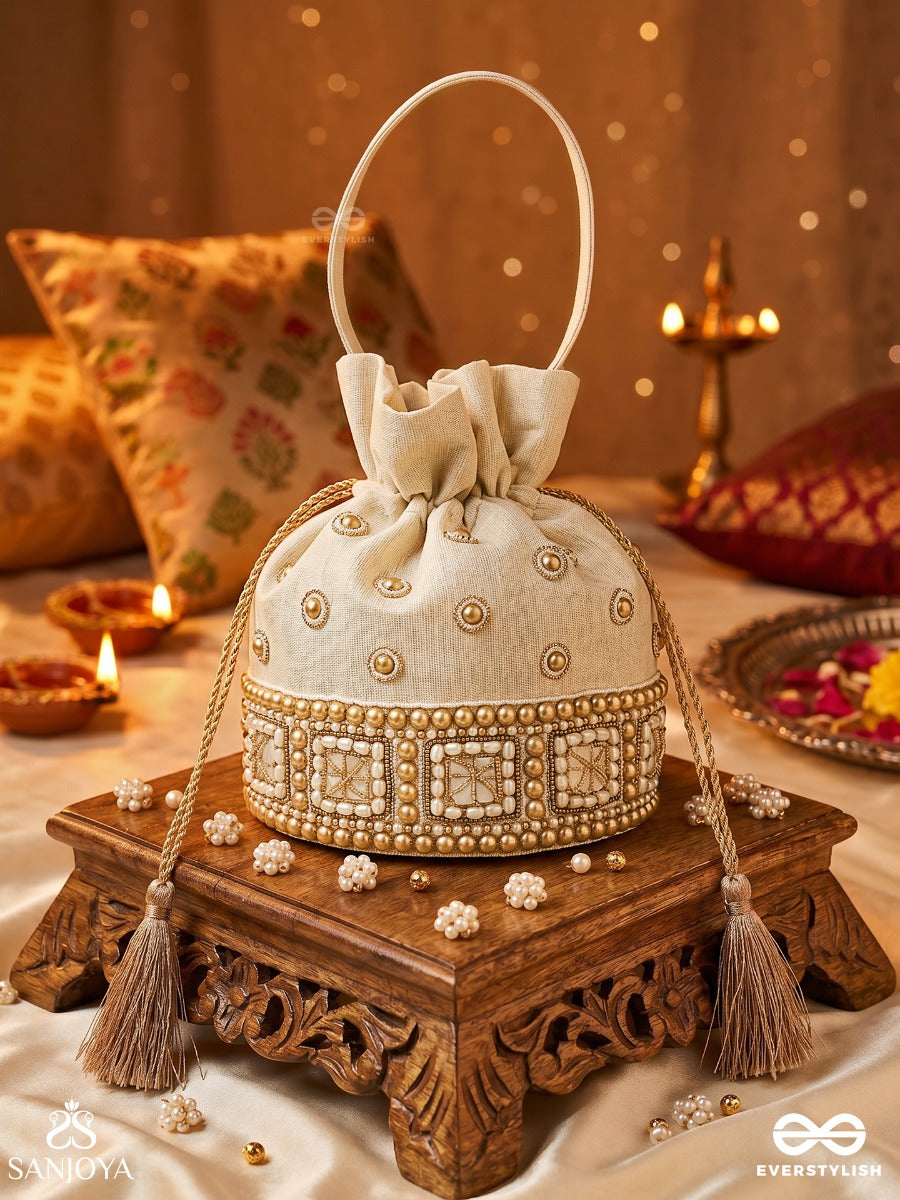 Rukhmehar – Potli Cream Champagne Bag With Pearl Panel Embellishment, Ornamental Accents And Side Tie Tassels
