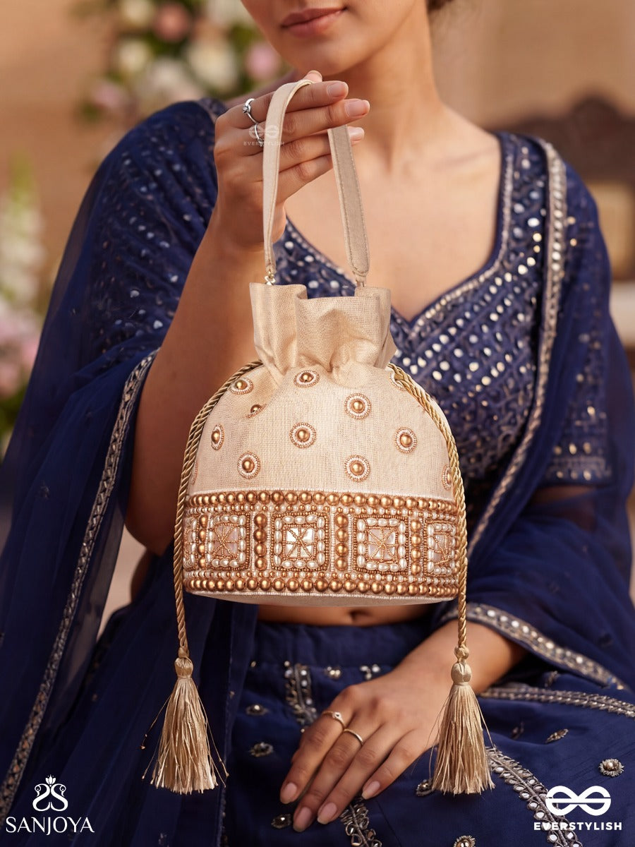 Rukhmehar – Potli Cream Champagne Bag With Pearl Panel Embellishment, Ornamental Accents And Side Tie Tassels