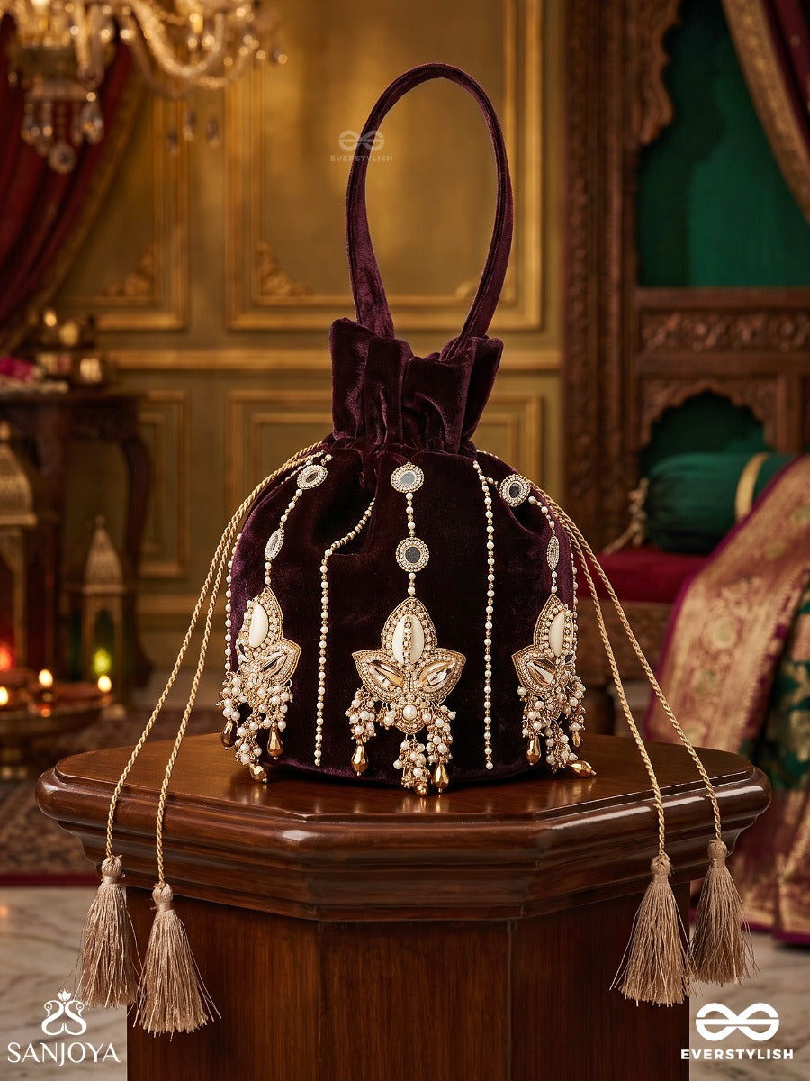 Shahzebaan – Potli Rich Wine Bag With Festive Appliqué Detailing, Pearl Highlights And Braided Tie Ends